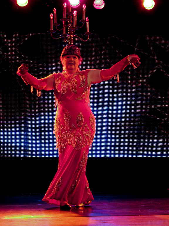 Halimeda in orange dress at Bellydance Superstars show